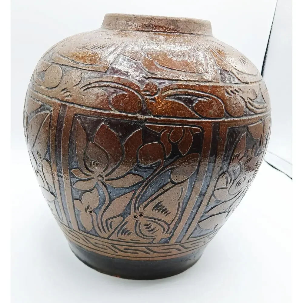 Vintage Asian Pottery Jar featuring designs of Fish, Bird, and Flowers